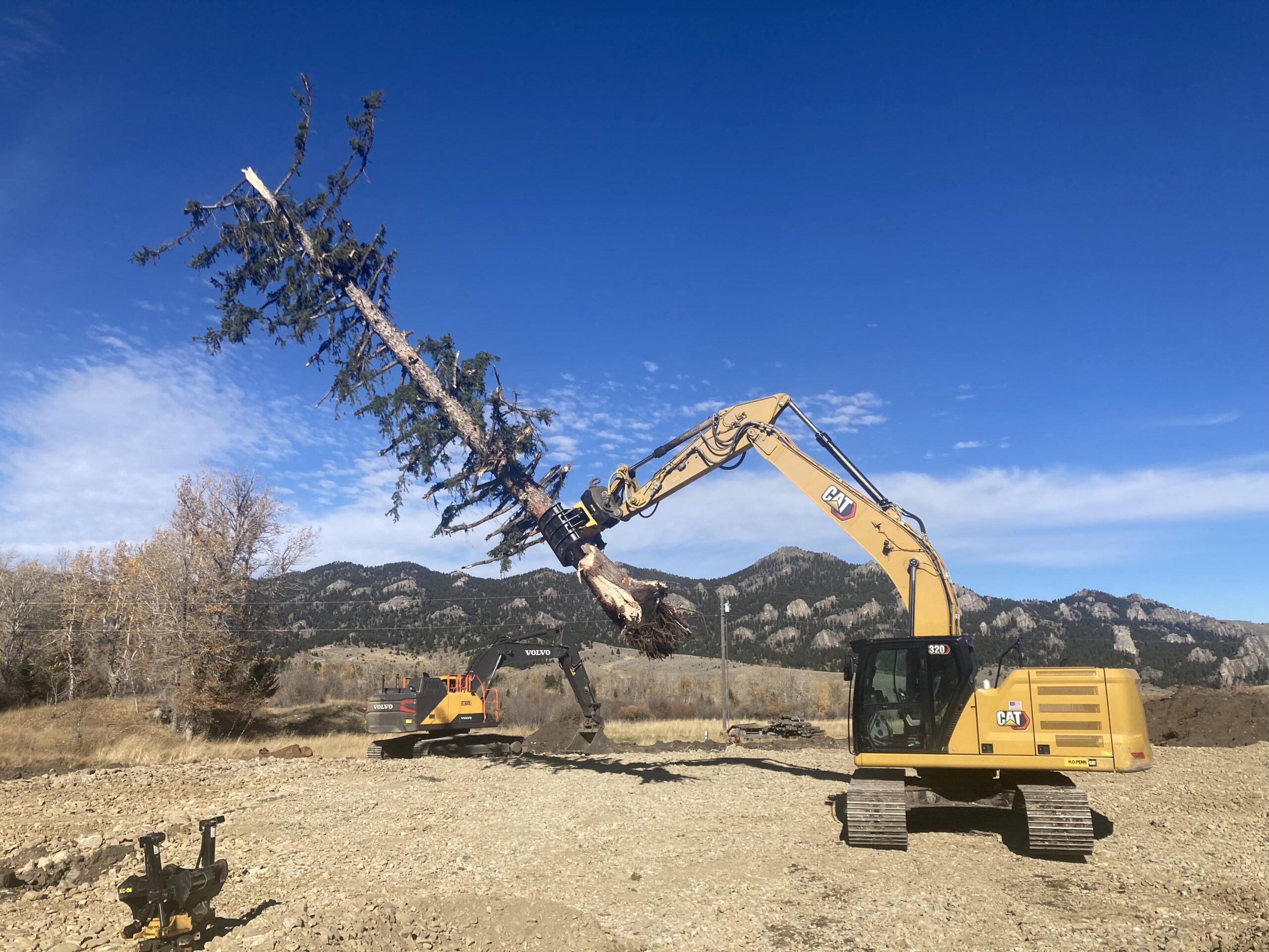 EZ Road Repair crew prepping a site and clearing land in Montana